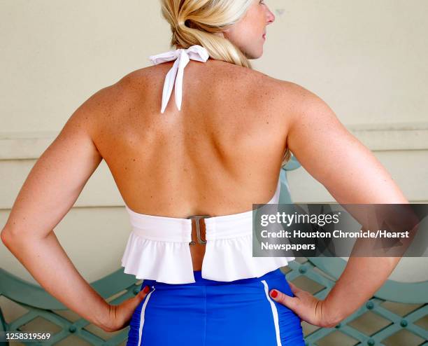 Model Kara Mullins wears a Fluid swim suit made by Galveston resident Megan Turnbow, photographed at the Hotel Galvez, Thursday, July 3 in Galveston.