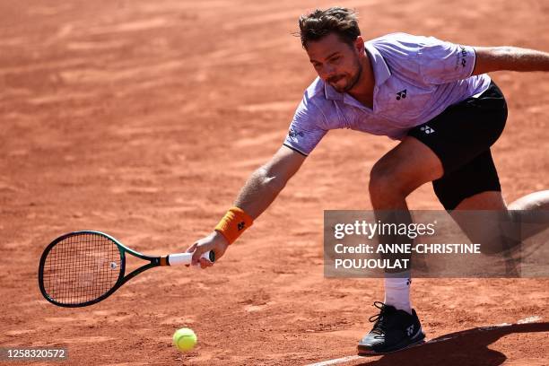 Switzerland's Stan Wawrinka misses to return the ball to Australia's Thanasi Kokkinakis during their men's singles match on day four of the...