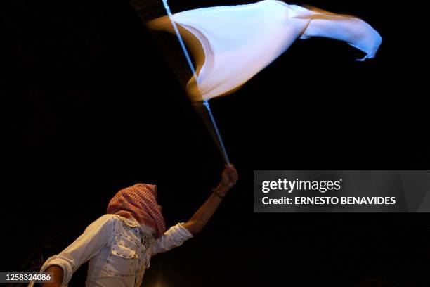 Peruvians demonstrate with white flags against Israel 's bombing of the Gaza Strip, outside the Israeli embassy in Lima, on January 13, 2008. AFP...