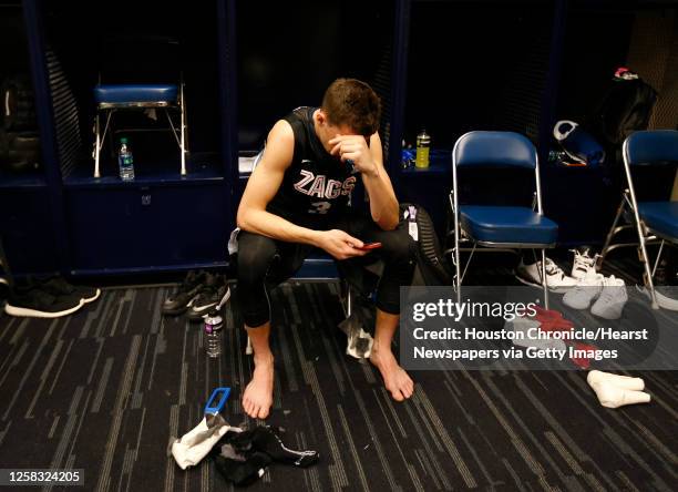 Gonzaga guard Kyle Dranginis sits in the locker room after falling to Duke in the NCAA South Regional final on Sunday, March 29 in Houston.