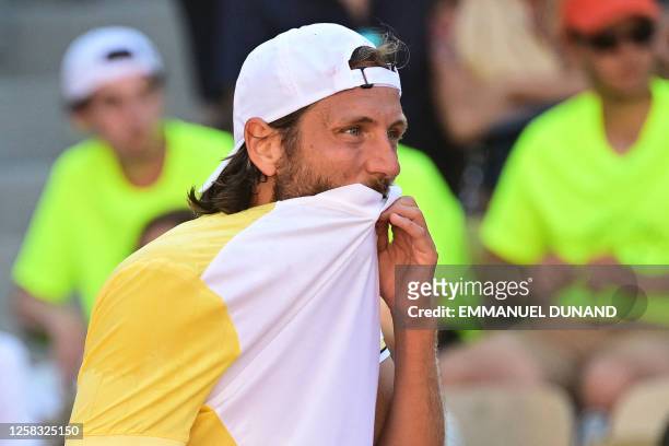 France's Lucas Pouille reacts during his match against Britain's Cameron Norrie during their men's singles match on day four of the Roland-Garros...