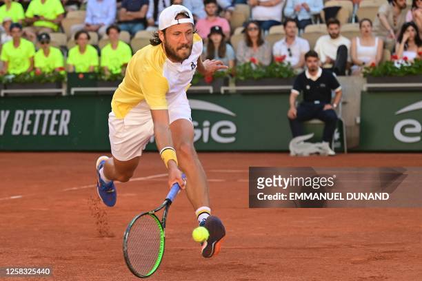 France's Lucas Pouille plays a forehand return to Britain's Cameron Norrie during their men's singles match on day four of the Roland-Garros Open...