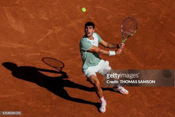 Spain's Carlos Alcaraz Garfia plays a backhand return to Japan's Taro Daniel during their men's singles match on day four of the Roland-Garros Open...