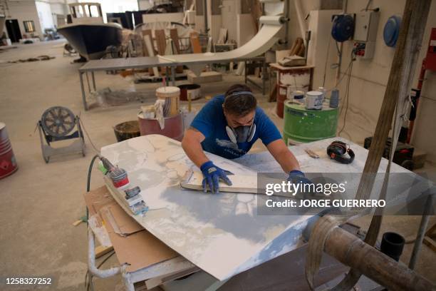 Polyester fiber technician Isaias Sevilla works on a rudder of a ship attacked by killer whales while sailing in the Strait of Gibraltar and taken...