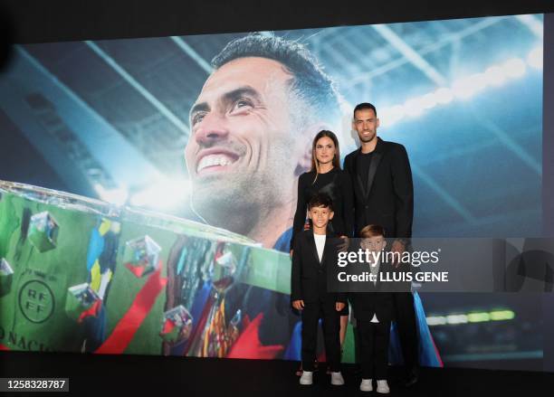 Barcelona's Spanish midfielder Sergio Busquets, his wife Elena Galera and their children arrive at his farewell ceremony at the Camp Nou stadium in...