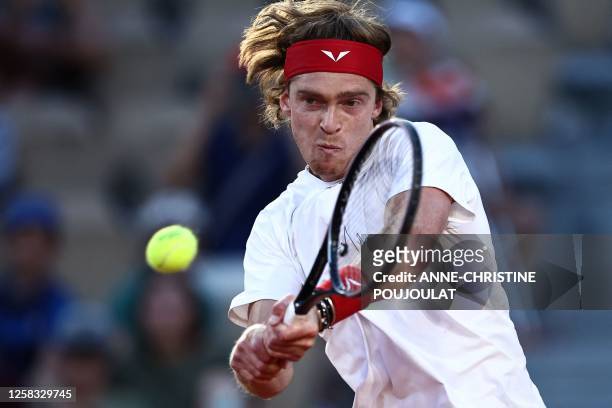 Russia's Andrey Rublev plays a forehand return to France's Corentin Moutet during their men's singles match on day four of the Roland-Garros Open...