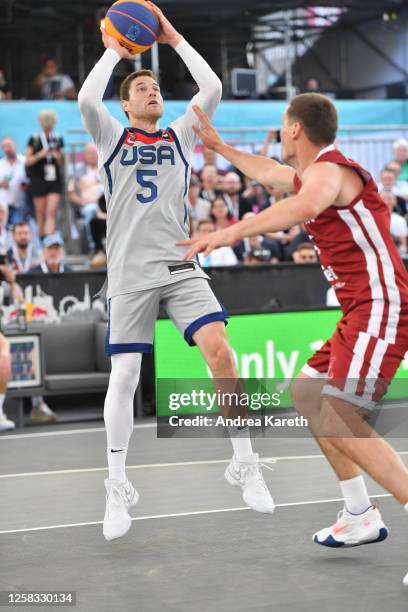 Jimmer Fredette of the USA controls the ball and Francis Gustavs Lacis of Latvia defends during the mens pool play match between the USA and Latvia...