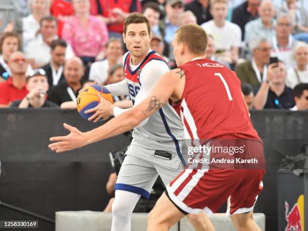 Jimmer Fredette of the USA vies with Nauris Miezis of Latvia during the mens pool play match between the USA and Latvia on Day 2 of the FIBA 3x3...