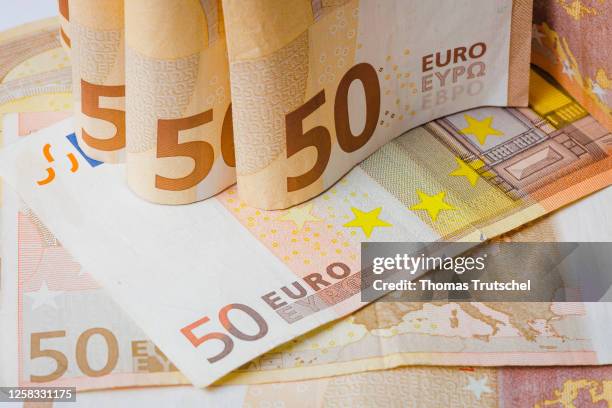 Symbolic photo on the subject of cash. 50 euro banknotes lie on a table on May 31, 2023 in Berlin, Germany.