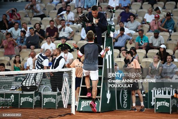 France's Corentin Moutet argues with umpire as he plays against Russia's Andrey Rublev during their men's singles match on day four of the...