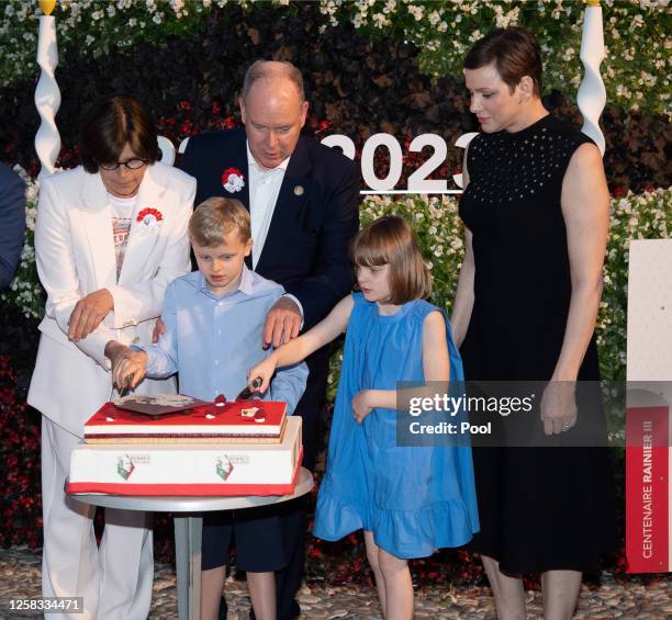 Princess Stephanie of Monaco, Prince Jacques of Monaco, Prince Albert II of Monaco, Princess Gabriella of Monaco and Princess Charlene of Monaco cut...