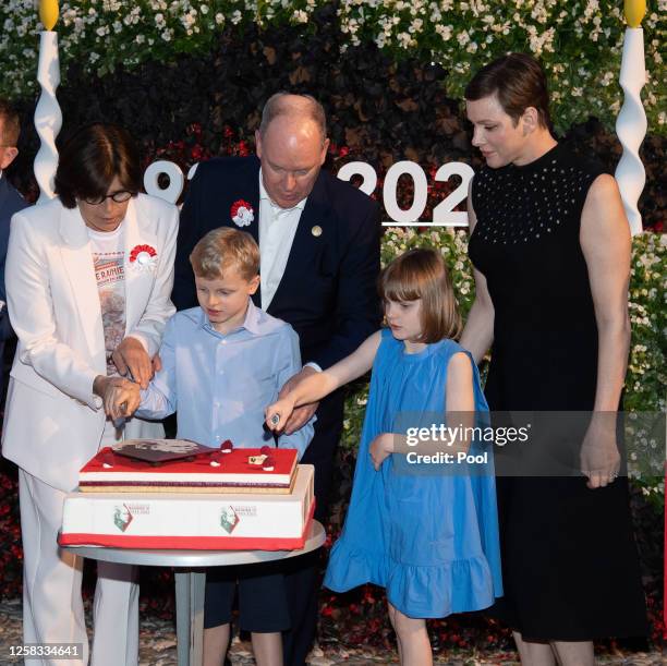 Princess Stephanie of Monaco, Prince Jacques of Monaco, Prince Albert II of Monaco, Princess Gabriella of Monaco and Princess Charlene of Monaco cut...
