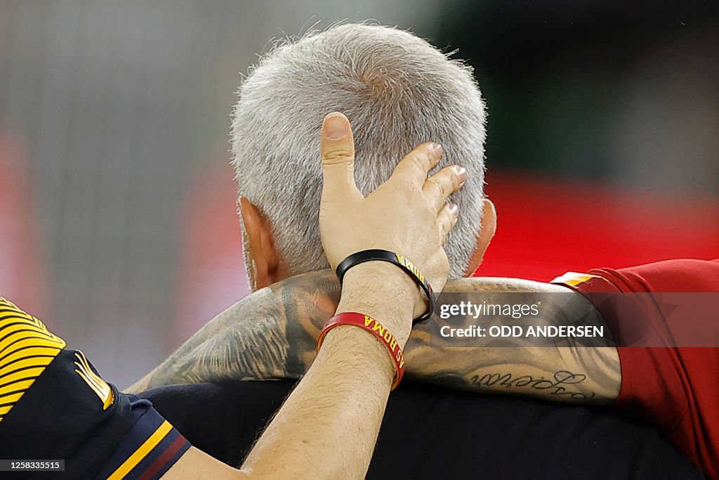 As Roma Coach AS Roma's Portuguese coach Jose Mourinho is consoled at the end of ...