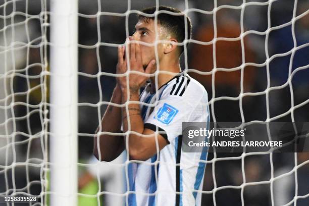 Argentina's forward Alejo Veliz reacts after Nigeria's first goal during the Argentina 2023 U-20 World Cup round of 16 football match between...