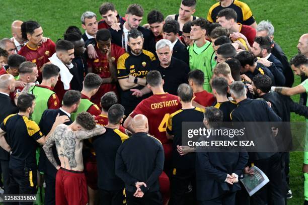 Roma's Portuguese coach Jose Mourinho speaks to his players after their loss in the UEFA Europa League final football match between Sevilla FC and AS...