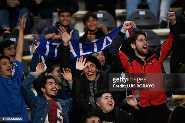 Italy's fans cheer for their team during the Argentina 2023 U-20 World Cup round of 16 football match between England and Italy at the Diego Armando...