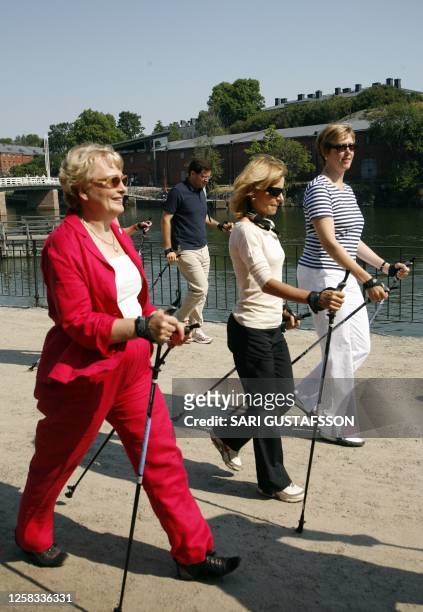 Spanish minister of health and consumption Elena Salgado is being introduced to use nordic walking sticks by Finnish Minister of Health and Social...