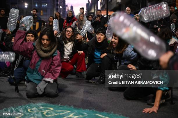 People take part in a protest called by Uruguay's Central Union in "defense of water" against the handling of the national authorities with respect...