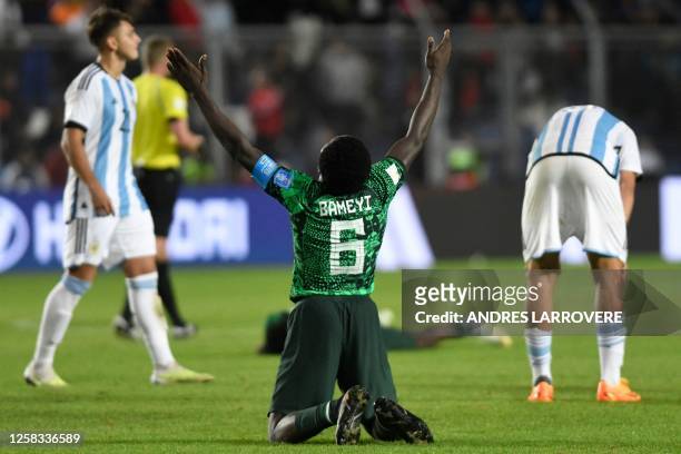 Nigeria's defender Daniel Bameyi celebrates after defeating Argentina during the Argentina 2023 U-20 World Cup round of 16 football match between...