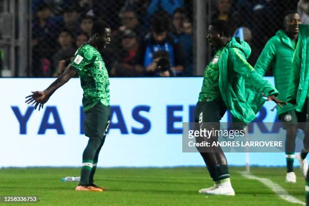 Nigeria's forward Rilwanu Haliru Sarki celebrates with teammates after scoring his team's second goal during the Argentina 2023 U-20 World Cup round...