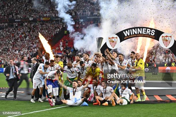 Sevilla's players celebrate with the trophy after winning the UEFA Europa League final football match between Sevilla FC and AS Roma at the Puskas...
