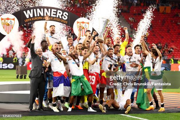 Ivan Rakitic of Sevilla FC lifts the trophy with his team-mates following their victory in a penalty shootout at the end of the UEFA Europa League...