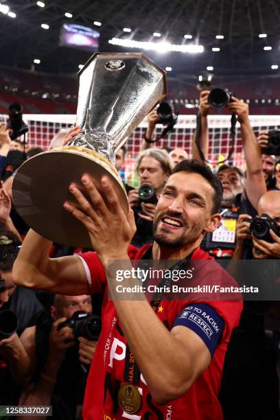 Jesus Navas of Sevilla FC celebrates with the trophy at the end of the UEFA Europa League 2022/23 final match between Sevilla FC and AS Roma at...
