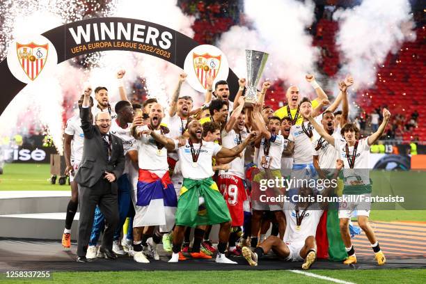 Ivan Rakitic of Sevilla FC lifts the trophy with his team-mates following their victory in a penalty shootout at the end of the UEFA Europa League...