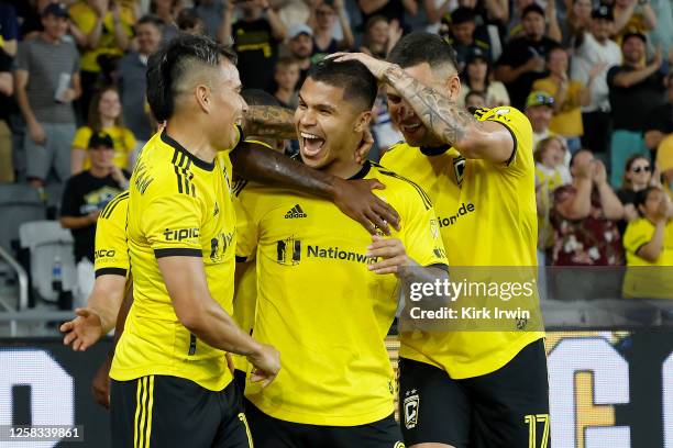 Cucho Hernández of the Columbus Crew is congratulated by Lucas Zelarayán and Christian Ramirez after scoring a goal in the second half against the...