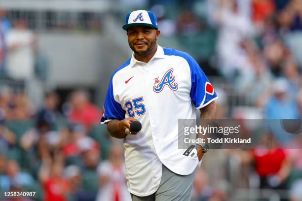 Former Atlanta Braves player Andruw Jones speaks to the fans prior to the game between the San Diego Padres and the Atlanta Braves at Truist Park on...
