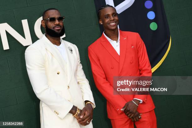 Producer/basketball player LeBron James and player Marquis "Mookie" Cook attend the Los Angeles premiere of "Shooting Stars" at the Regency Village...