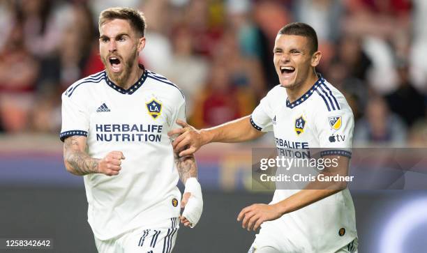 Tyler Boyd of the Los Angeles Galaxy reacts with teammate Dejan Joveljic after scoring the game winning goal during the second half of their game...