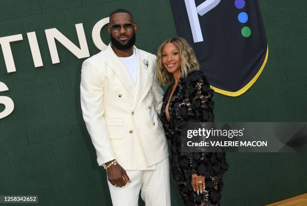 Producer/basketball player LeBron James and his wife Savannah James attend the Los Angeles premiere of "Shooting Stars" at the Regency Village...