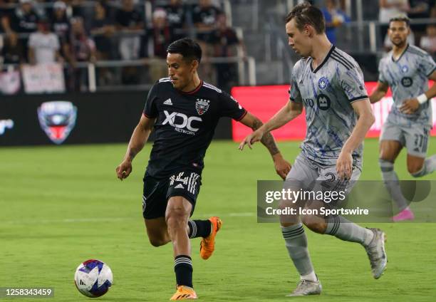 United midfielder Andy Najar dribbles away from CF Montréal midfielder Lassi Lappalainen during a MLS game between DC United and CF Montreal, on May...