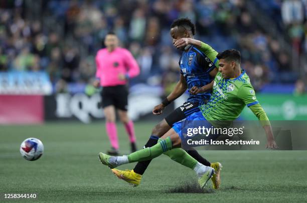 San Jose Earthquakes forward Jeremy Ebobisse defends against Seattle Sounders defender Xavier Arreaga during a MLS matchup between the San Jose...