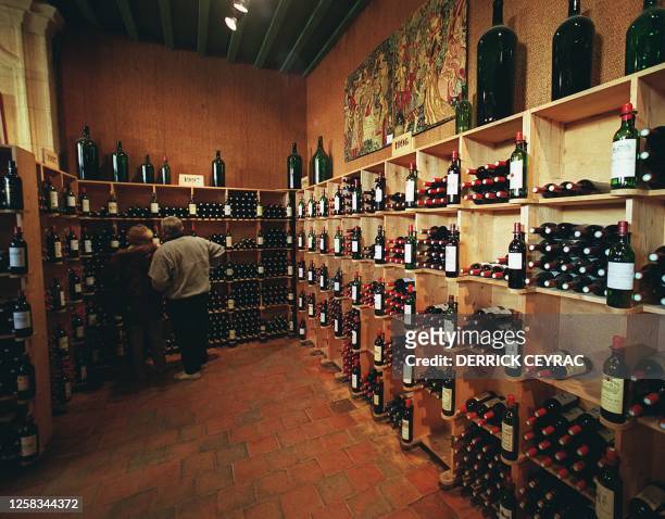 People buy the bottles of Bordeaux wine 05 December 1999 in the village of Saint-Emilion. The southwest village of Saint-Emilion and its famous...