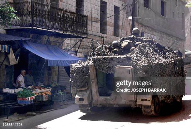 South Lebanon Army armored personal carrier patrol 18 May 2000, in the village of Marjayoun in the Israeli-occupied zone in south Lebanon. The SLA...