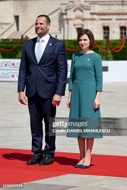 President of Moldova Maia Sandu and Malta's Prime Minister Robert Abela pose for photographs on arrival at the European Political Community Summit in...