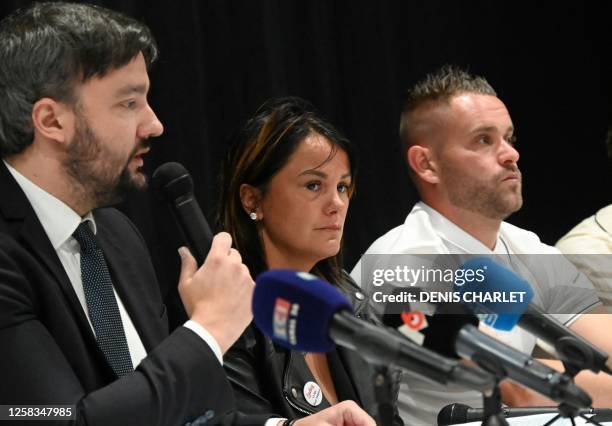 Lawyer Pierre Debuisson speaks alongside the parents of 'Lindsay', a 13 year-old who committed suicide, as they address media representatives during...