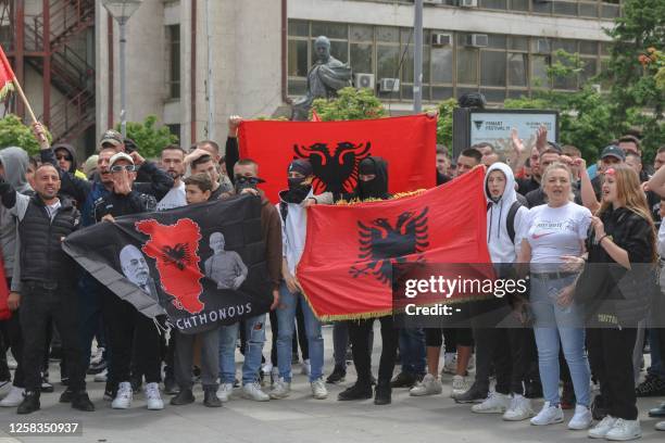 Kosovo Albanians hold Albanian flags take part in a demonstration in the south of Mitrovica on June 1, 2023. Several hundred people rallied in the...