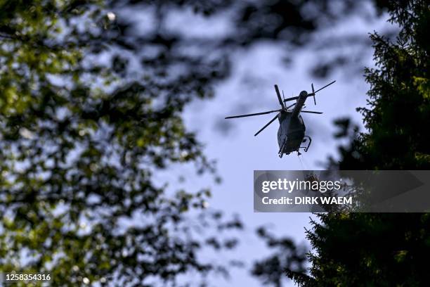 Illustration shows a civil protection helicopter with a special water-dropping bag pictured on the scene of a fire in the Hautes Fagnes between...