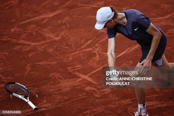 Italy's Jannik Sinner reacts as he plays against Germany's Daniel Altmaier during their men's singles match on day five of the Roland-Garros Open...