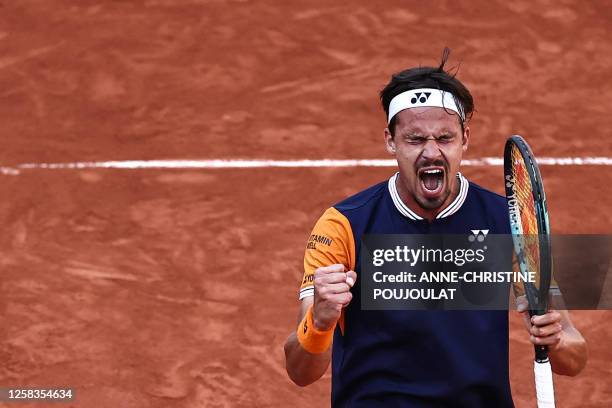 Germany's Daniel Altmaier celebrates after winning against Italy's Jannik Sinner at the end of their men's singles match on day five of the...