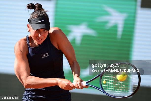 France's Oceane Dodin plays a backhand return to Tunisia's Ons Jabeur during their women's singles match on day five of the Roland-Garros Open tennis...