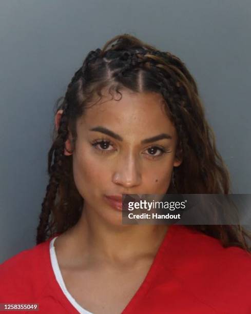 In this handout image provided by Miami-Dade Corrections, Danielle Curiel, also known as DaniLeigh, is seen in a booking photo following an arrest...