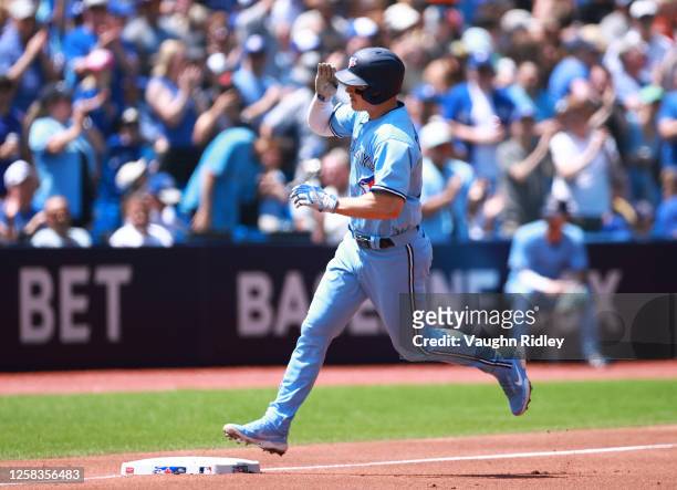 Matt Chapman of the Toronto Blue Jays rounds the bases after hitting a two-run home run in the first inning against the Milwaukee Brewers at Rogers...