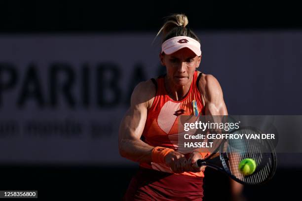 Ukraine's Lesia Tsurenko plays a backhand return to US Lauren Davis during their women's singles match on day five of the Roland-Garros Open tennis...