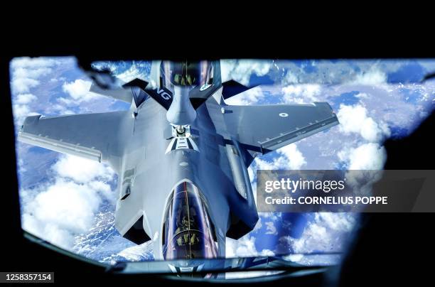 An Italian F-35 Lightning fighter jet refuels from an Air Refueling Wing KC-135 Stratotanker during the Arctic Challenge Exercise near Orland Main...