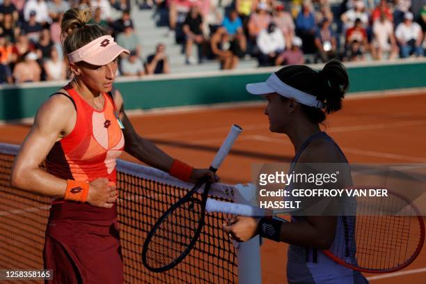 Ukraine's Lesia Tsurenko speaks with US Lauren Davis after winning during their women's singles match on day five of the Roland-Garros Open tennis...