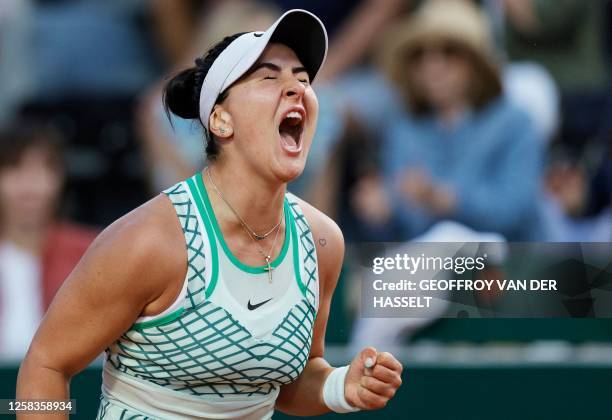 Canada's Bianca Andreescu reacts after a point to Spain's Carla Suarez Navarro during their women's singles match on day five of the Roland-Garros...